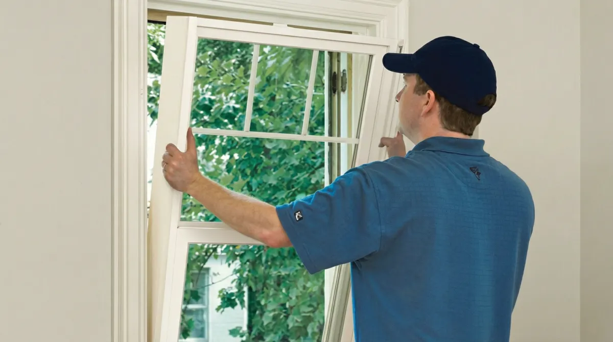 Professional contractors performing a residential window insulation and replacement service in Newark, NJ